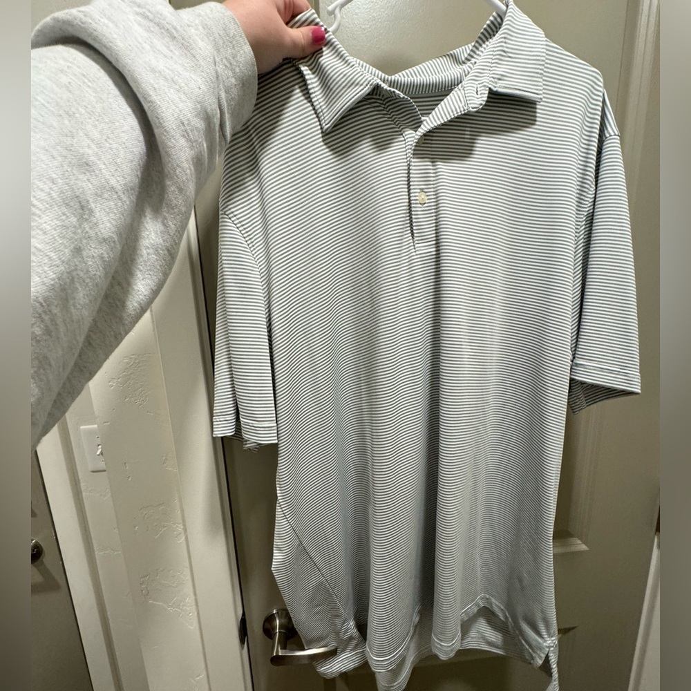 Blue and white striped vineyard vines polo